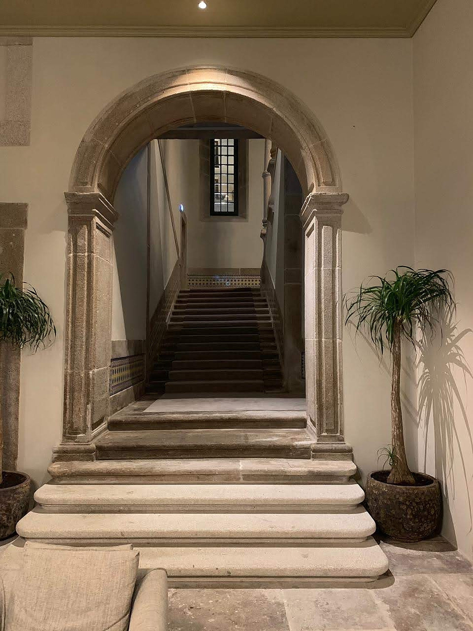 A stone arch over a stair